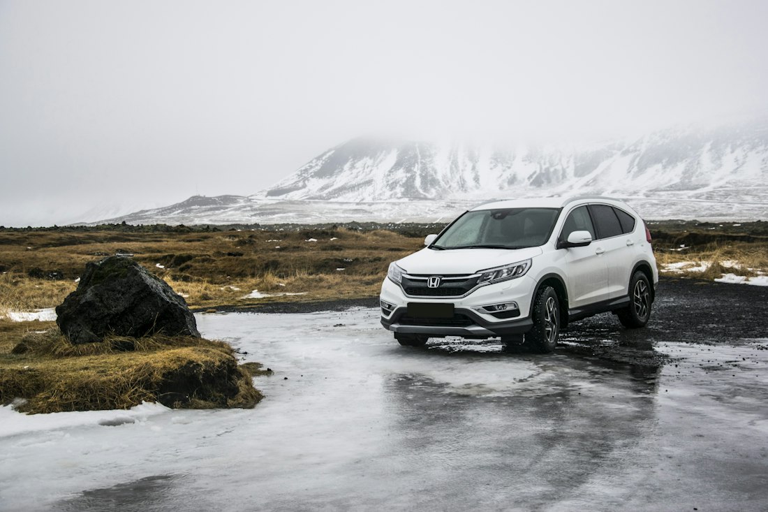 A white SUV photographed from the front at pickup, ready for a guided inspection